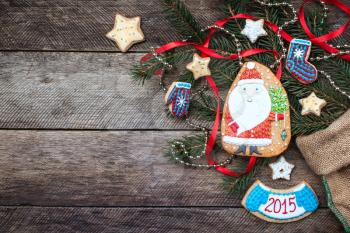 Christmas Santa Claus and New Year star cookies in rustic style on wood. Free space for text
