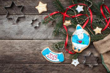 New Year 2015 symbol sheep cookie and pastry on wood in rustic style. Free space for text
