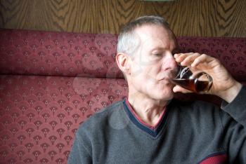 Royalty Free Photo of a Man Drinking Beer