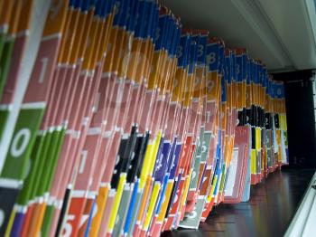 Numbered medical records folders on the shelf.