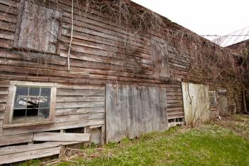 Old abandoned barn on the farmland.