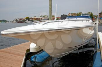 A view of the private yacht's bow, docked in the marina.