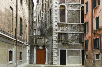 Venice, Italy - April 1, 2013: Street views of ancient architecture in Venice, Italy. Venice is a city in northeastern Italy sited on a group of 118 small islands separated by canals and linked by bri