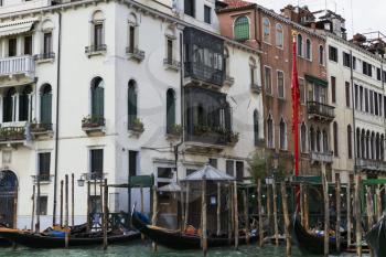 Venice, Italy - April 1, 2013: Street views of canals and ancient architecture in Venice, Italy. Venice is a city in northeastern Italy sited on a group of 118 small islands separated by canals and li