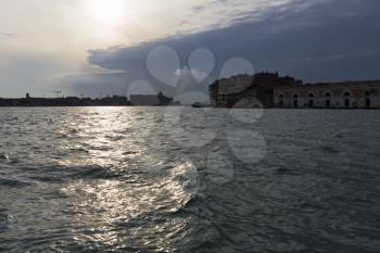 Venice, Italy - April 1, 2013: Street views of canals and ancient architecture in Venice, Italy. Venice is a city in northeastern Italy sited on a group of 118 small islands separated by canals and li