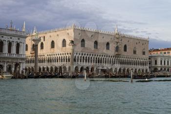 Venice, Italy - April 1, 2013: Street views of canals and ancient architecture in Venice, Italy. Venice is a city in northeastern Italy sited on a group of 118 small islands separated by canals and li