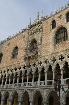 Venice, Italy - April 1, 2013: Street views of ancient architecture in Venice, Italy. Venice is a city in northeastern Italy sited on a group of 118 small islands separated by canals and linked by bri