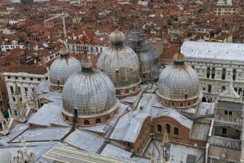 Rooftop views of canals and ancient architecture in Venice, Italy. Venice is a city in northeastern Italy sited on a group of 118 small islands separated by canals and linked by bridges.