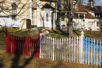Colorful picket fence on a farmland.