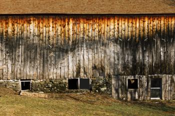 Old weathered barn on a farmland.