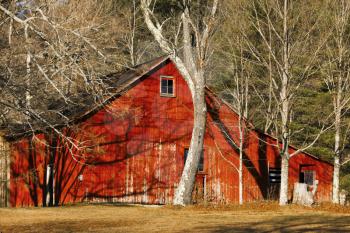 Old weathered barn on a farmland.