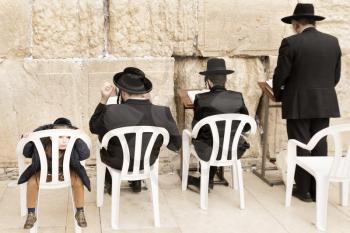 Jerusalem, Israel-March 14, 2017: The Western Wall is the holiest place where Jews are permitted to pray, though it is not the holiest site in the Jewish faith, which lies behind it, on Temple Mount.