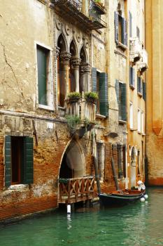 Venice, Italy-April 1, 2013: Street views of canals and ancient architecture of Venice, Italy.