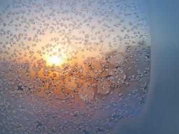 frost and sun on winter glass