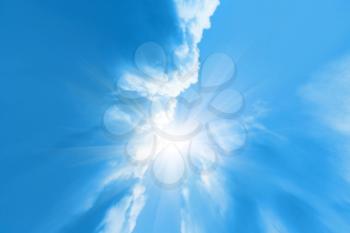 blue sky background with clouds and sunlight