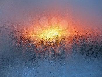 natural water drops and sunlight on window glass