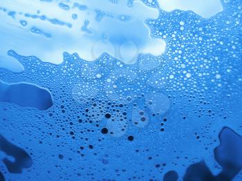 soap foam bubbles on the glass