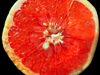 close-up of juicy red orange isolated on black