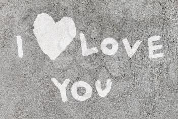 inscription I love you with abstract heart on the concrete wall