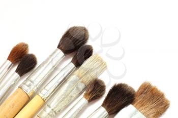 Set of paint brushes on a white background