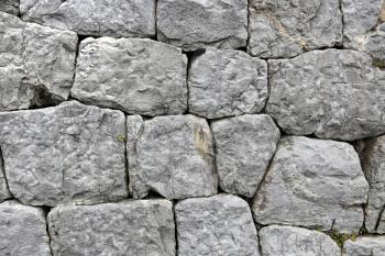 Ancient  stone wall background closeup 