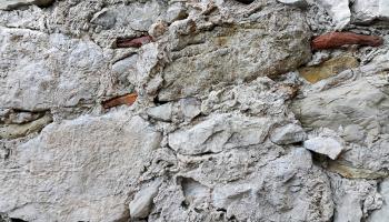 Ancient stone wall background closeup 