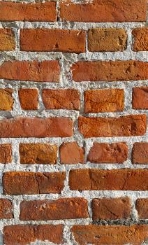 Texture of ancient red brick wall closeup