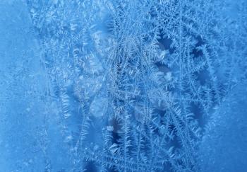 Natural ice pattern on window winter glass