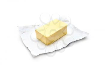 Piece of butter on a white background