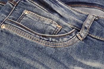Fragment of dark blue jeans, close-up background