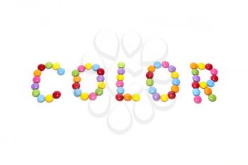 Word ''Color'' made from multicolored sweets candy isolated on white background