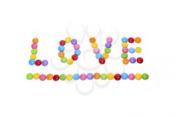 Word ''Love'' made from multicolored sweets candy on white background