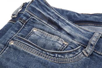 Fragment of dark blue jeans on white background