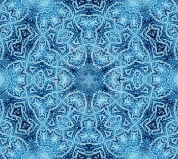 Bright blue abstract concentric pattern with soap foam on glass