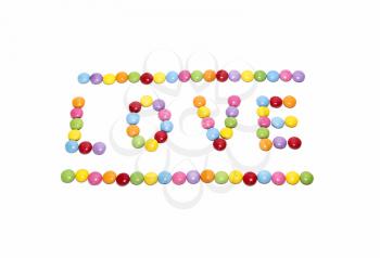 Word ''Love'' made from multicolored sweets candy on white background