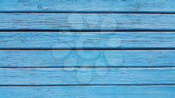 Texture of old wooden blue fence close-up