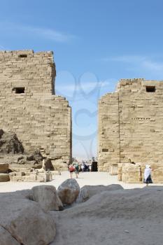 LUXOR / EGYPT - OCTOBER 13, 2012: Tourists among the ancient ruins of Karnak Temple