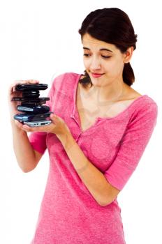 Royalty Free Photo of a Young Woman Holding a stack of Cell Phones