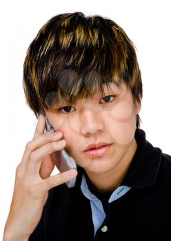 Royalty Free Photo of a Young Boy Talking on his Cellphone
