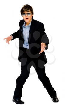 Royalty Free Photo of a Teenage Boy Modeling Clothing in a Dance Pose