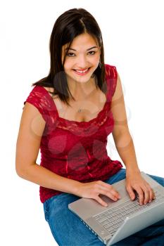 Royalty Free Photo of a young Woman Sitting on the Floor with a Laptop