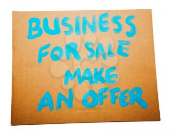 Royalty Free Photo of a Business For Sale Sign on a Placard