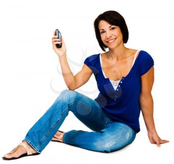 Royalty Free Photo of a Woman Sitting Down Holding her Cell Phone