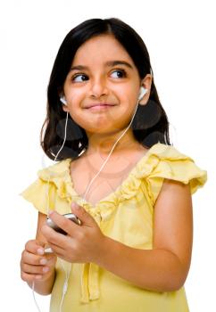 Royalty Free Photo of a Girl Listening to Music Through Earbuds on her Mp3 Player