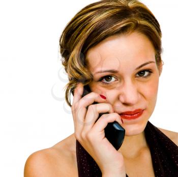 Portrait of a teenage girl talking on a mobile phone isolated over white