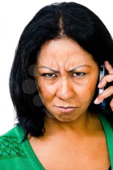 Royalty Free Photo of a Woman Scowling Talking on her Mobile Phone