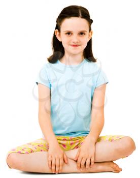 Portrait of a girl sitting and smiling isolated over white