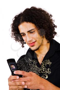 Royalty Free Photo of a Young Man Texting on a Mobile Phone