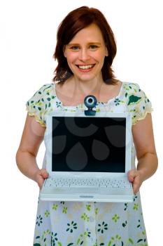 Portrait of a woman showing a laptop and smiling isolated over white