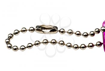 Beads in a key chain isolated over white
